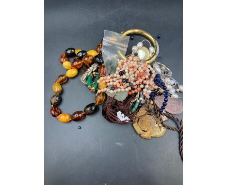 A selection of amber, jade and coral and some costume jewellery 