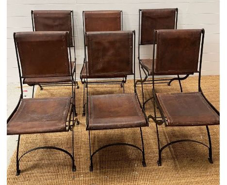 Six wrought iron folding chairs, sling style leather seat and seat back, aged brown leather with double row top stitching 