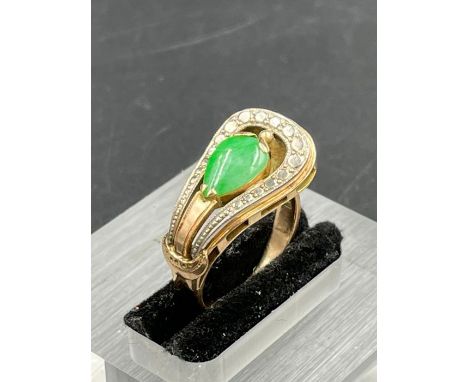 A 14ct gold ring with central Jade stone Size M