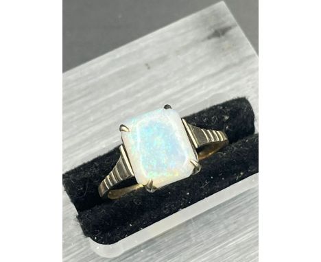 A 9ct gold and opal ring