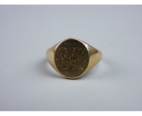 A NINE CARAT GOLD GENT'S SIGNET RING, monogrammed 'R L H', inscribed to the reverse 'Your Jeanette', size 'X', 9.5 grms