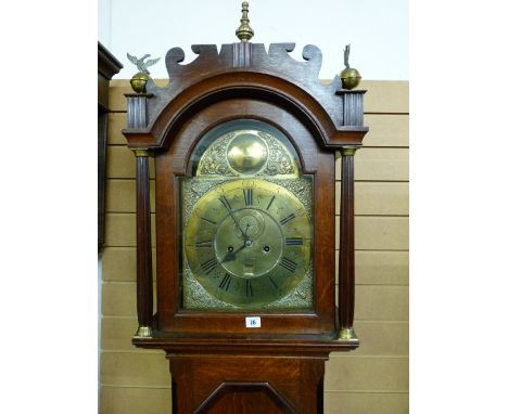 A CIRCA 1820 BRASS DIAL LONGCASE CLOCK, the 12 ins arched top dial set with Roman numerals, subsidiary seconds dial and date 