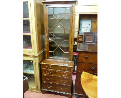 A NEAT 19th CENTURY MAHOGANY TWO PIECE BOOKCASE CUPBOARD, the upper section having a single door with thirteen astragal panes