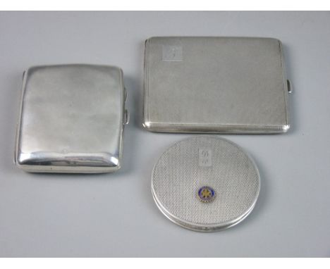 TWO HALLMARKED SILVER CIGARETTE CASES and a lady's compact, a plain case marked Chester 1911, a slim engine turned case marke