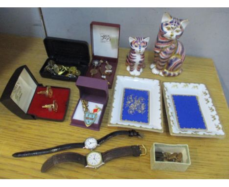 A mixed lot to include two Patek Philippe Limoges dishes, two Crown Derby  paperweights with no stoppers, cufflinks, badge, l