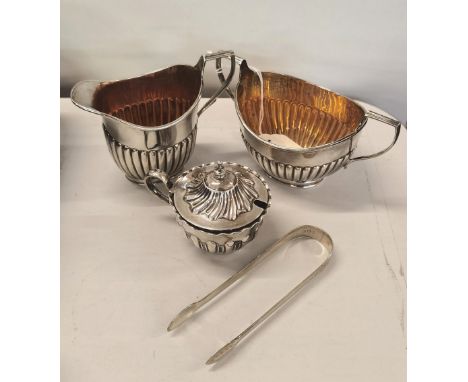 Silver to include a cream jug, sugar and mustard pot, together with a pair of tongs Location: Port 