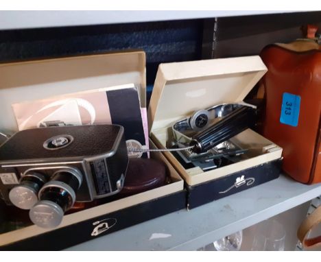 A vintage Paillard-Bolex cine camera and boxed accessories 