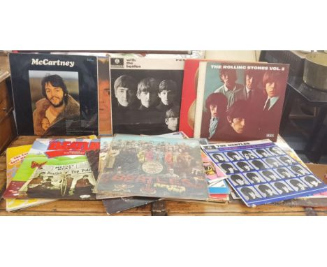 A collection of vinyl records to include The Beatles, Rolling Stones, David Bowie, Dire Straits, together with a First UK pre