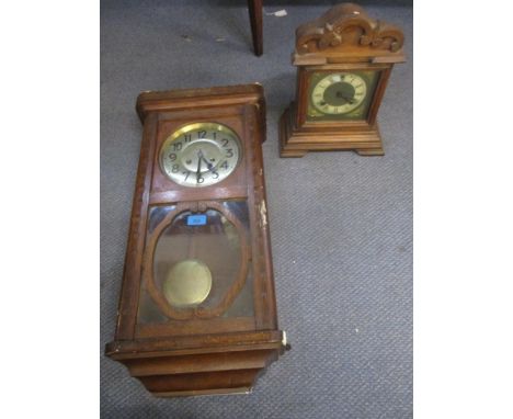 The Ansonia Clock Co wooden cased 8-day mantel clock, the movement striking on a gong, and a wooden cased Vienna style regula