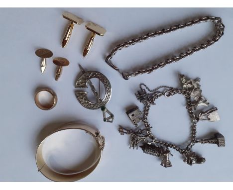 Costume jewellery to include a gold plated bangle, a silver Scottish brooch, a gold plated wedding band, late 20th Century go