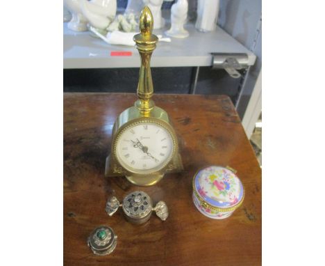 A Swiza dressing table alarm clock, porcelain pill box, and two continental silver stone set pill boxes, one in the form of a