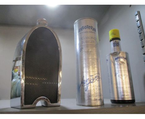 A chrome plated liqueur bottle in the form of a vintage car grill, and a collectable Angostura Ltd Ed Diamond Jubilee bottle 