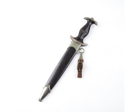 A WWII German SS dagger and scabbard, having an ebony handle, inlaid eagle over swastika and SS hilt with nickel hilt the bla