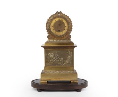 A 19th century French empire gilt metal mantle clock under a glass dome, the clock 23cm wide 14cm deep 44cm high