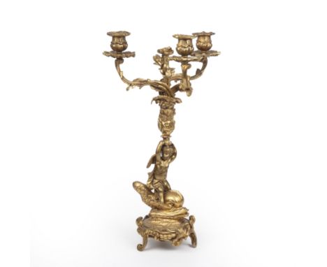 A 19th century gilt metal three branch candelabra with a cherub and dolphin base 26cm wide 47cm highGood condition, with some