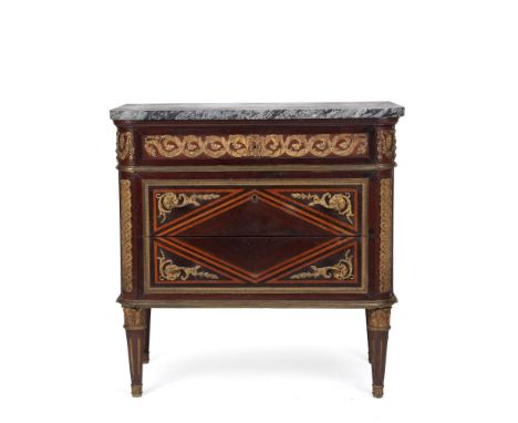 A French Louis XVI style marquetry kingwood marble topped commode in the manner of Jean-François Leleu (1729 -1807) having th