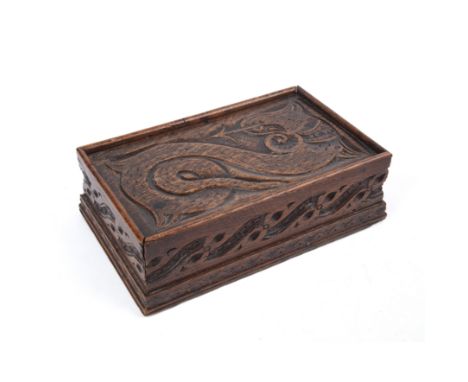 A 18th/ 19th century carved oak box with Celtic carved decoration and a sliding lid 35cm wide 21cm deep 11cm highGood, minor 