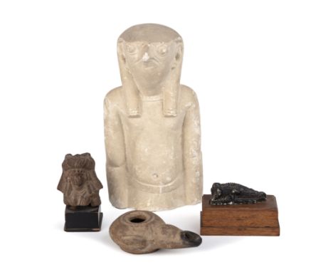 Antiquities to include an Indus valley terracotta head a Roman oil lamp and a Egyptian style figure 23cm high and a crocodile