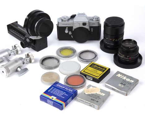 A Leicaflex outfit to include a 1966 body no 1153684 with a Leitz Elmarit - R 1:2.8/90 no 2415727 lens a Leitz Elmarit - R 1: