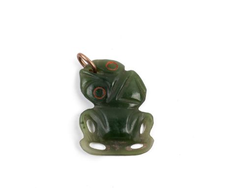 A Maori nephrite jade tiki pendant, the stylised eyes and a yellow metal clasp 2.7cm x 3.3cm 