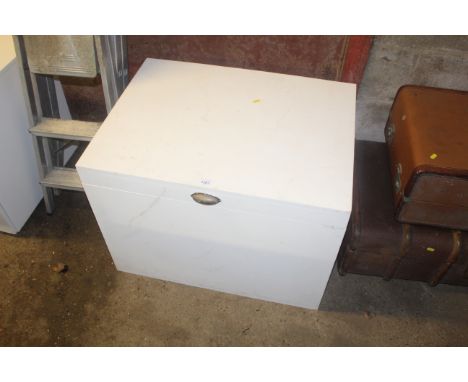 A white painted MDF storage trunk