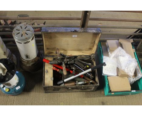 A wooden and metal bound chest containing various tools to include rotary hand drill, bicycle pumps, grease guns, oil can etc