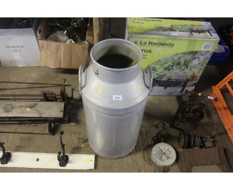 An aluminium churn manufactured by Grundy Teddington Ltd. of Middlesex (lacking lid)