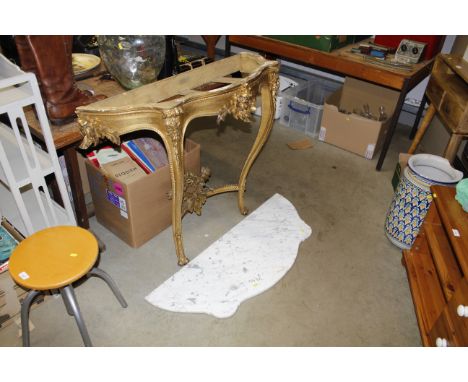 An antique French console table with marble top