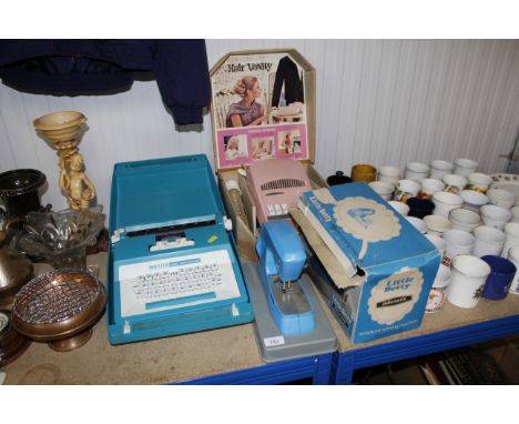A child's Petite typewriter, Morphy Richards hair vanity set, Little Betty miniature sewing machine etc.