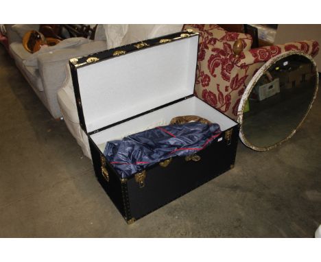 A trunk and contents of various textiles