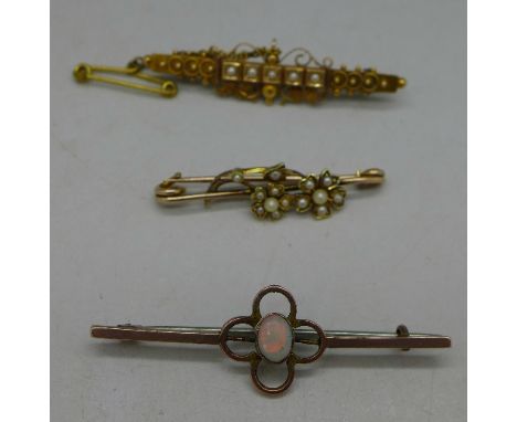 A Victorian 15ct gold and seed pearl brooch, Birmingham 1892, a 9ct gold and opal brooch and a seed pearl set floral brooch, 