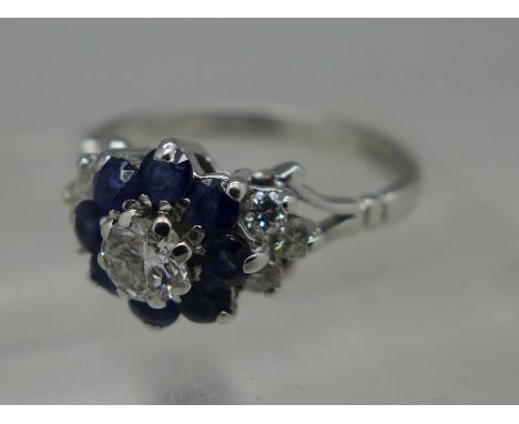 An 18ct white gold, diamond and sapphire ring, weight 3.6g, size M