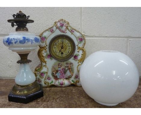 A china clock and table lamp