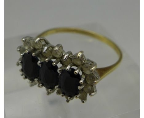 A 9ct gold triple cluster ring, weight 2.5g, size P