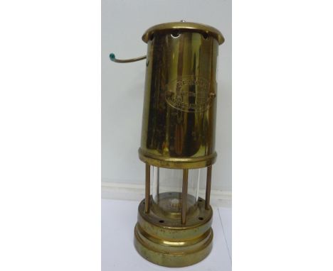 A brass miner's safety lamp