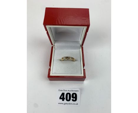 9k gold ring with 2 diamonds (1 missing), size J/K, w: 3.5 gms