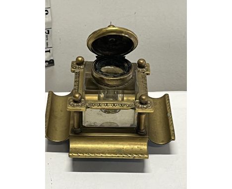 A antique brass inkwell 