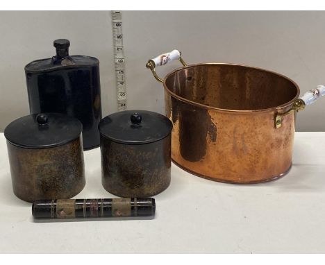 A copper and enamel handled pan, large enamel flask, two vintage metal containers and a papier mache hat pin holder, shipping
