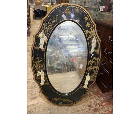 A large Chinese oval mirror with applied decoration 94x63cm, shipping unavailable 