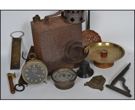 A mixed lot of vintage metal ware to include a vintage Shell petrol can, industrial gauge, scales, alarm clock etc.