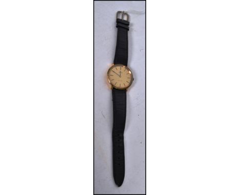 A 20th century gentlemans vintage Omega De Ville wristwatch having gilded face with baton numerals, swiss movement within. Fi