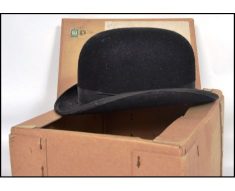 A vintage 20th century ladies hunting bowler hat by Lock and Co London of moleskin construction with black ribbon band comple