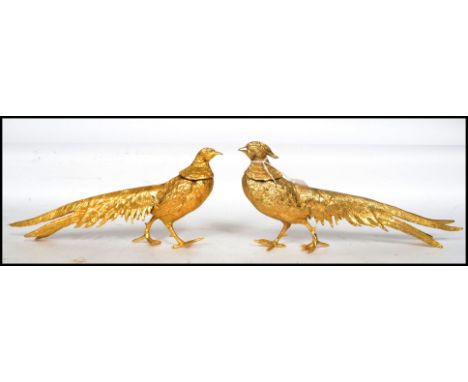 A stunning pair / brace of European cast gilt metal  models of ornamental pheasants, each heavily detailed. Measures 13.5 hig