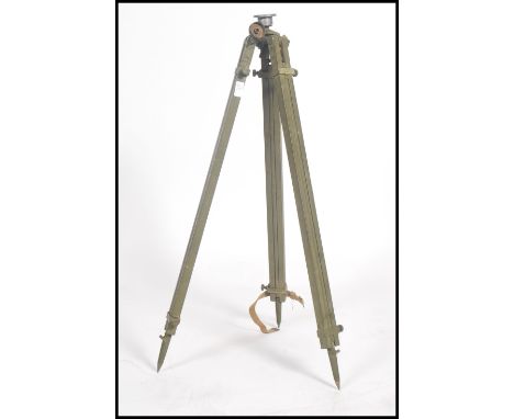 A vintage 20th century retro WW2 mk2 tripod stand in camo green with military plaque for New Zealand 1942.