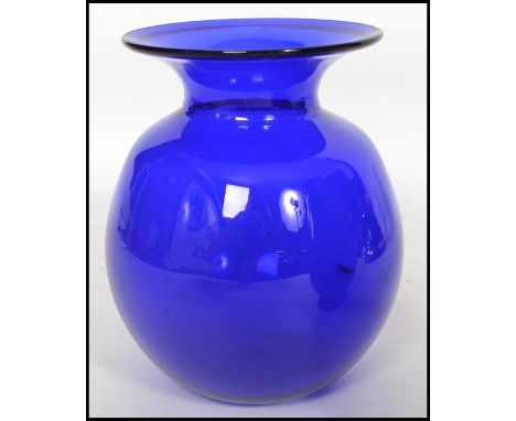 A group of 20th studio art Bristol Blue glass wares to include paperweight, vases, ashtray along with a Wade blue ceramic whi