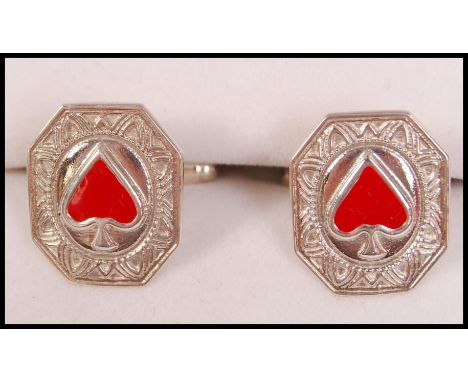 A pair of gents 20th century silver and enamel set cuff links / cufflinks. Each with enamel set heart symbols ( bridge intere