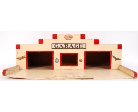 A vintage handmade wooden petrol station/ garage with various motoring adverts for Esso, BSA, Shell & others. Measures approx