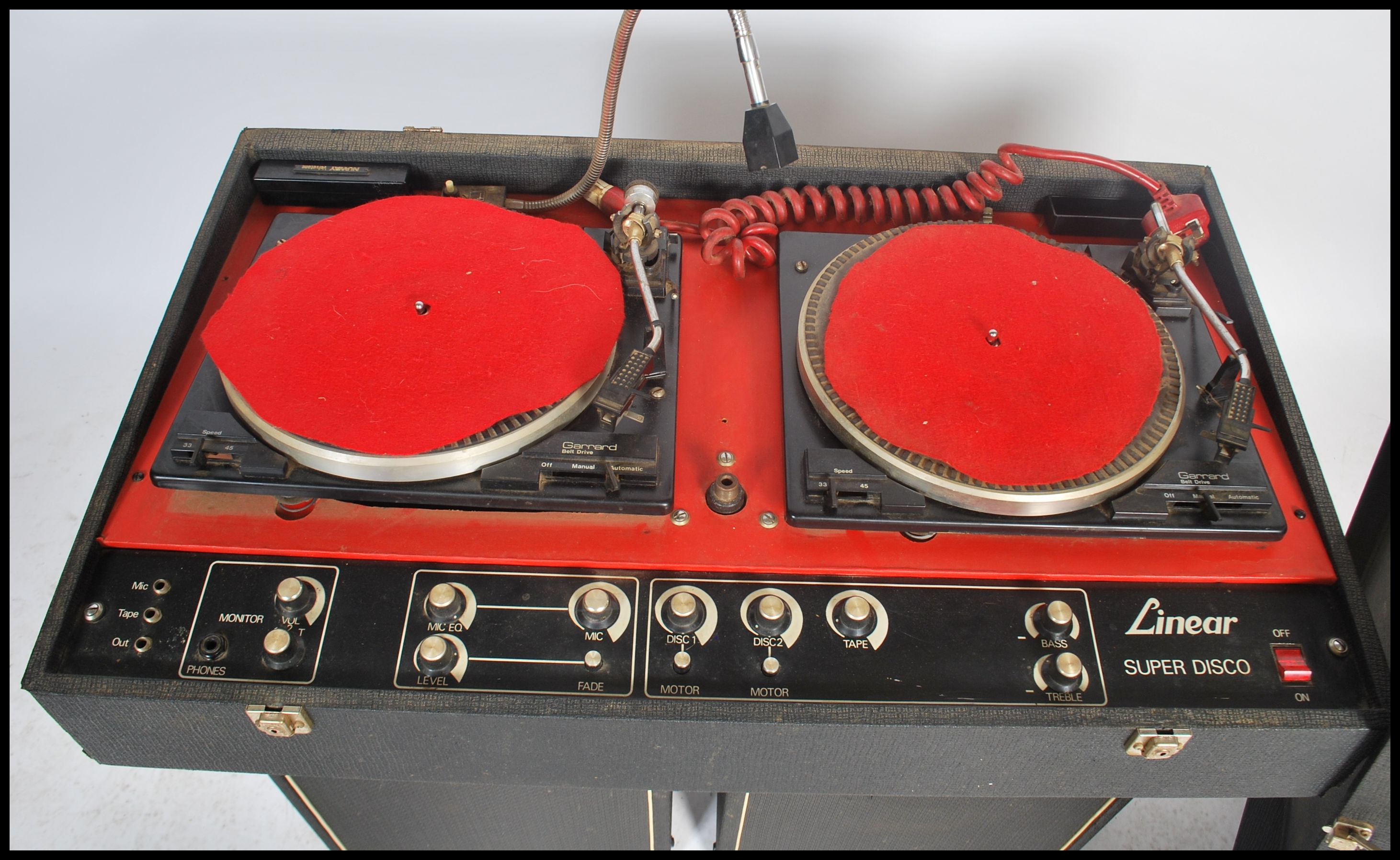 A vintage DJ record deck system and speakers consisting of two Garrard
