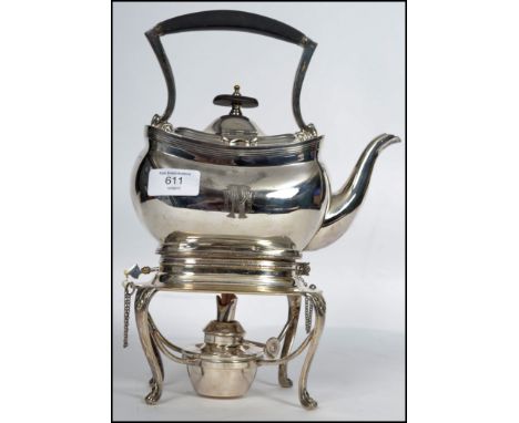 A silver plated 20th century spirit burner kettle raised on stand with claw feet makers stamp to base.