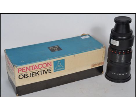 A vintage Pentacon Objektive 4/300 VB M42 X 1 Camera Telephoto Lens complete in the original box.  